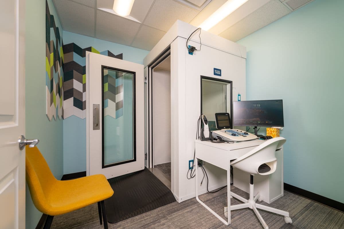 Audiologist consulting with patient about hearing test results