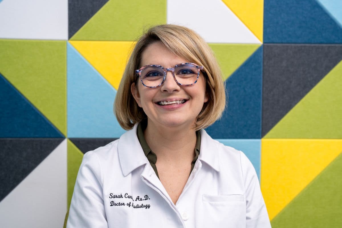 Dr. Sarah Curtis working with patients at Sounds of Life Hearing Center