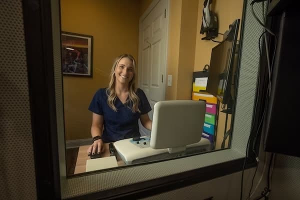 Dr. Cara Donovan conducting tinnitus evaluation at Sounds of Life, Lake County Ohio