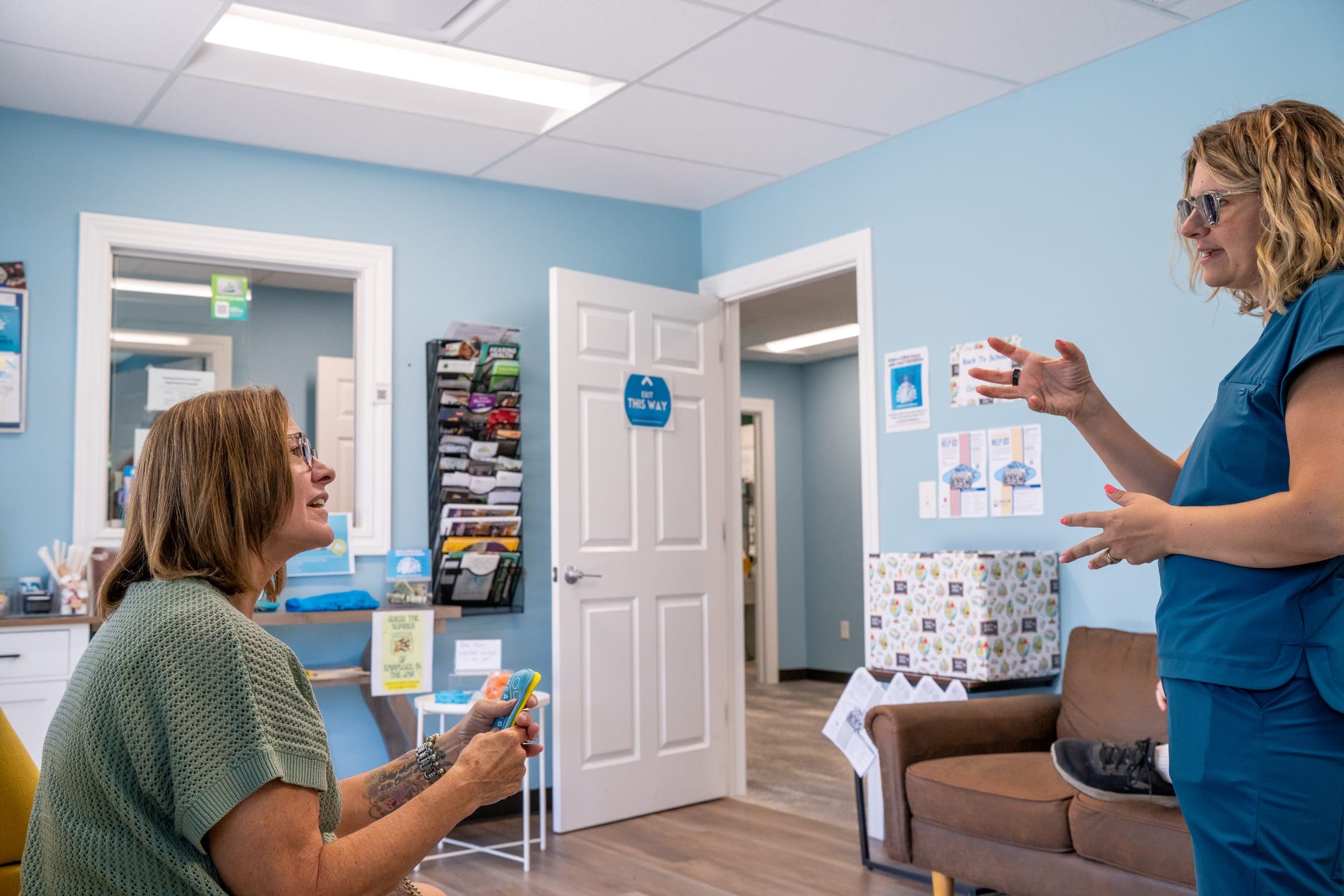 Audiologist explaining hearing test results at Sounds of Life Hearing Center, about 20 minutes from Willoughby, Ohio