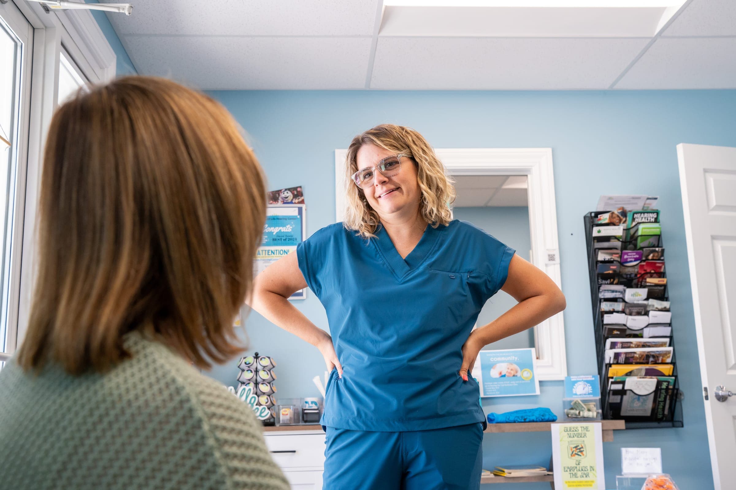 A Doctor of Audiology listening to a patient during a tinnitus consultation at Sounds of Life Hearing Center