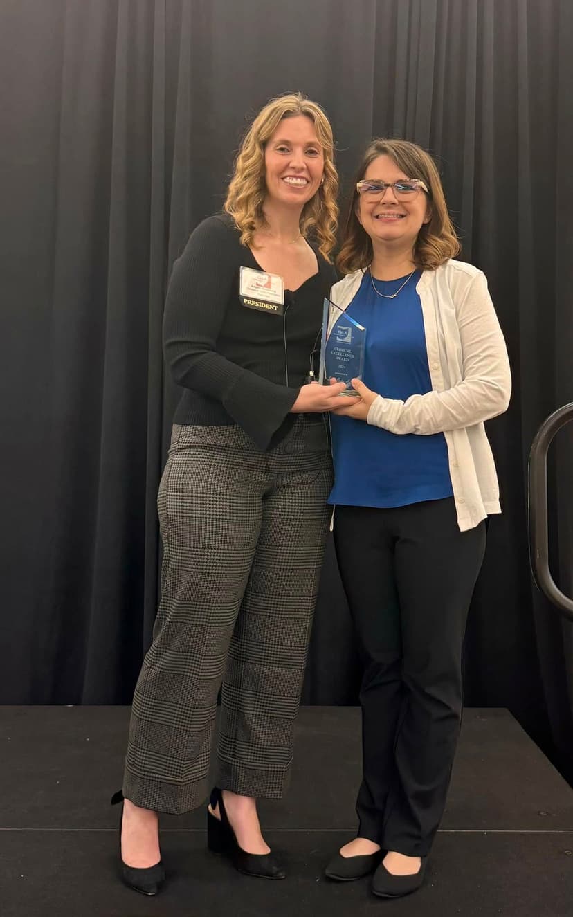 Dr. Sarah Curtis receiving the Clinical Excellence Award