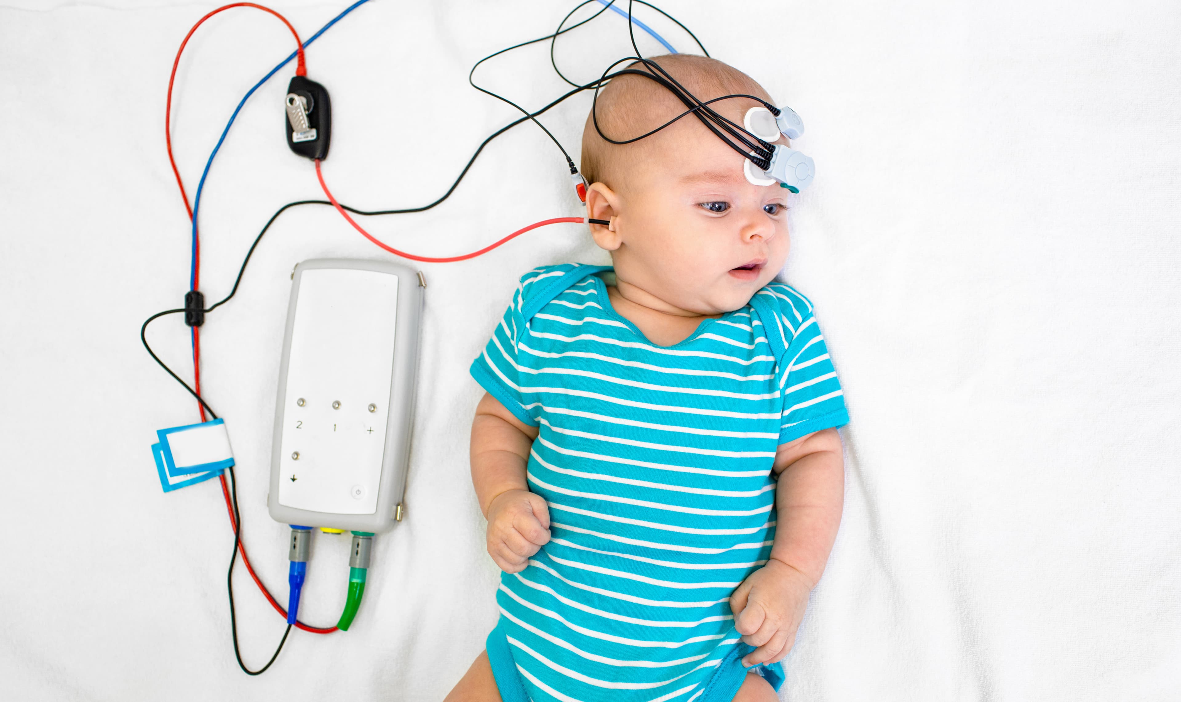 A newborn baby during a hearing assessment